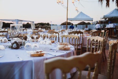 Elegance table set up for wedding in beige. Wedding dinner set up near the sea, Event set up